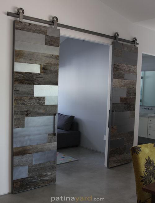 gray barn wood and satin steel metal panels barn door