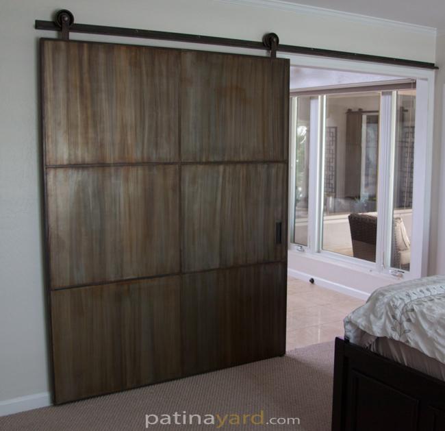warehouse style barn door with patina metal