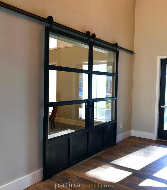 double patina steel and glass barn doors