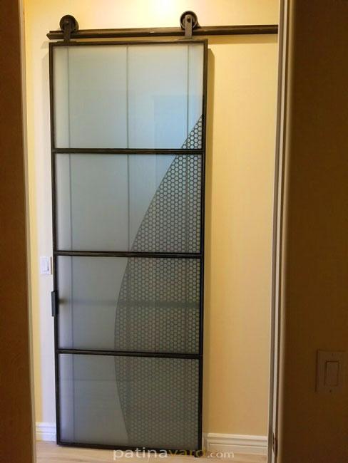 modern glass and metal barn door