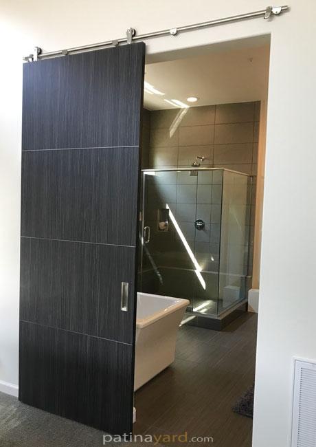 custom modern barn door with brushed stainless steel