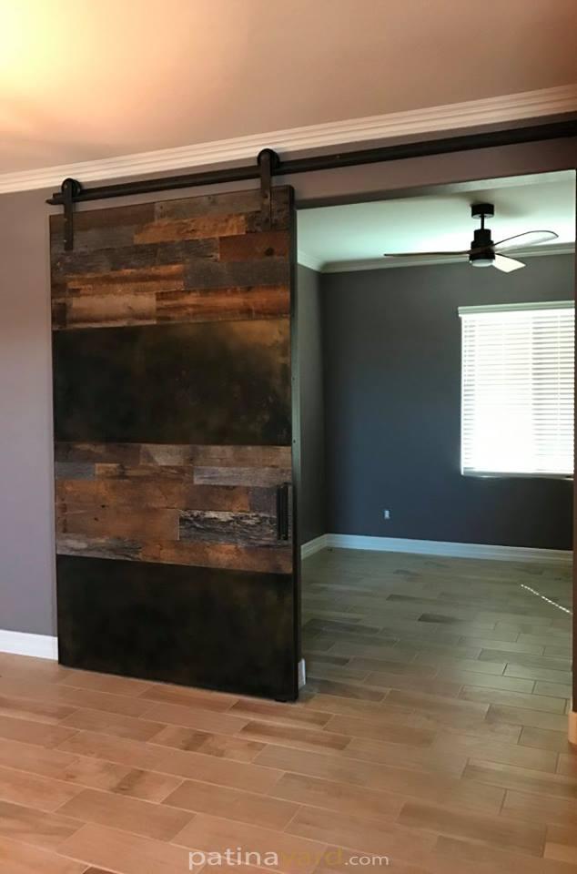 patina metal and reclaimed barn wood barn door