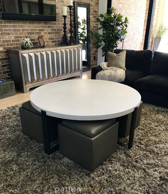 x metal base with round white concrete top