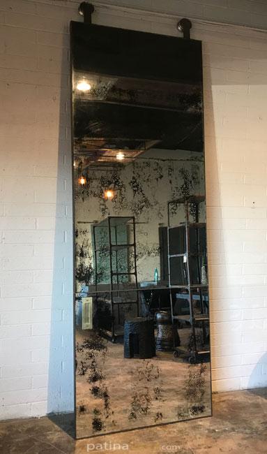 large antique barn door with brass seams