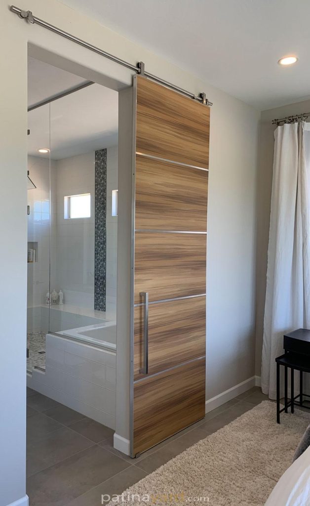 modern barn door with stainless hardware