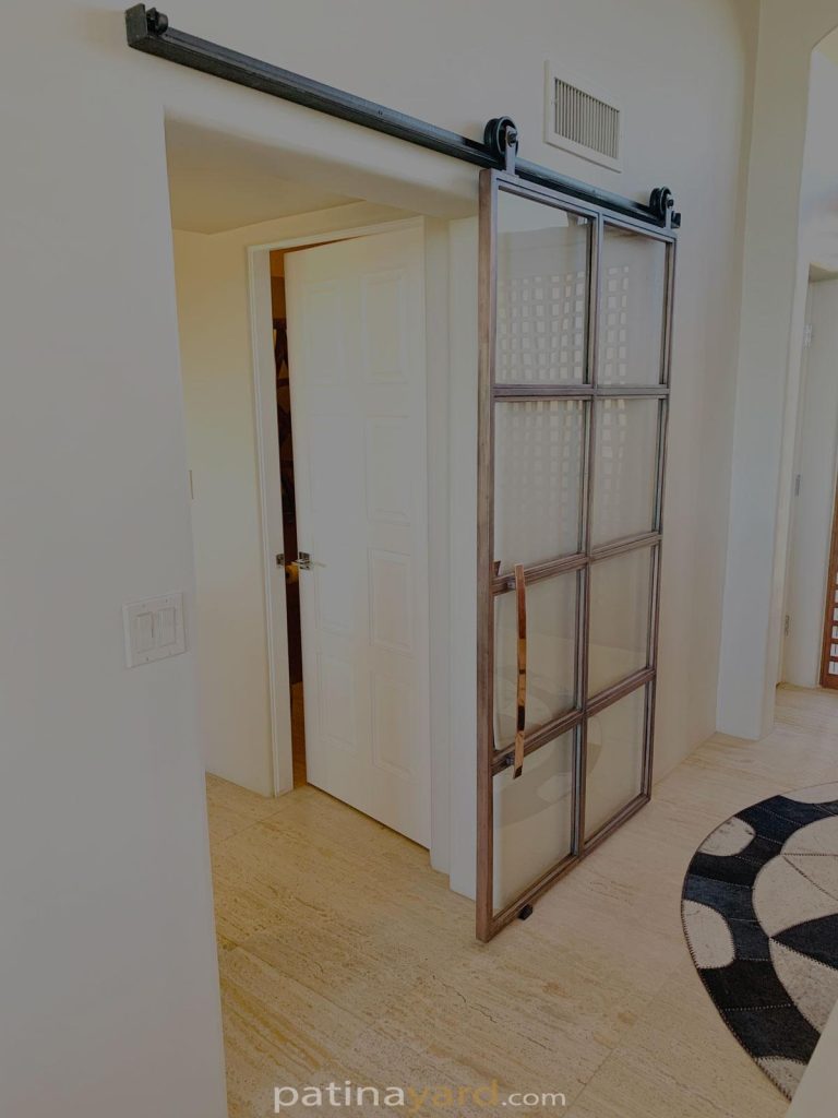 custom copper barn door and glass