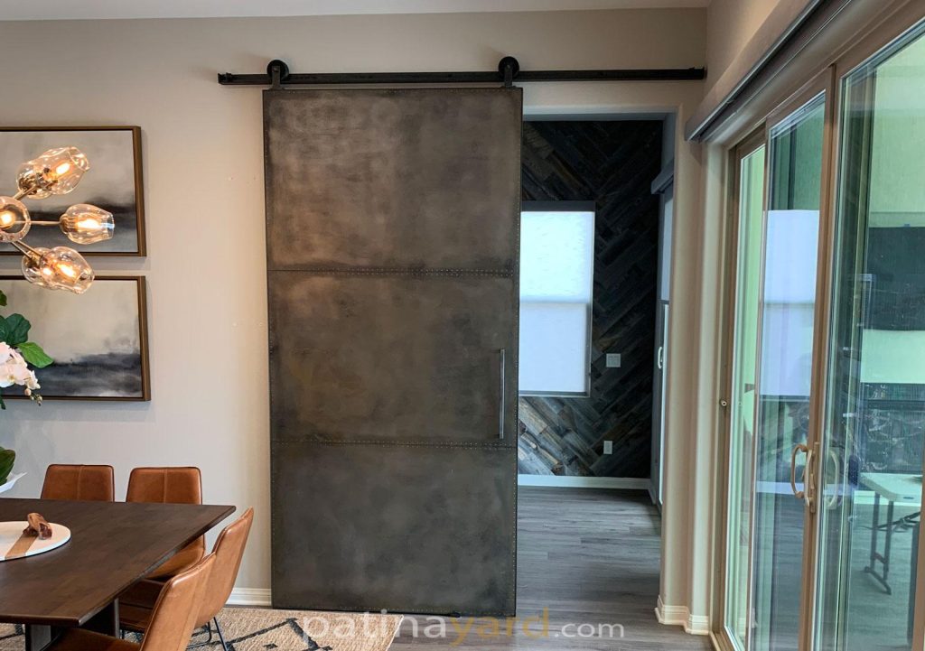 metal barn door with rivets and custom made hardware