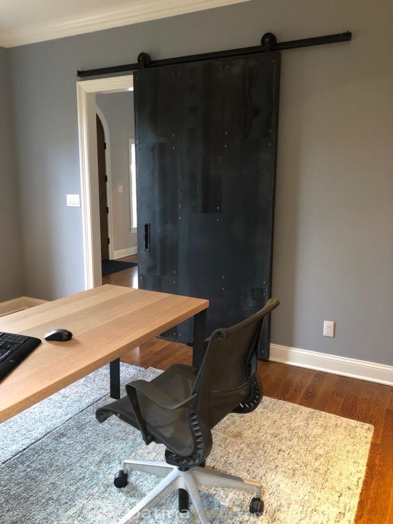 Hot rolled steel door with rivets