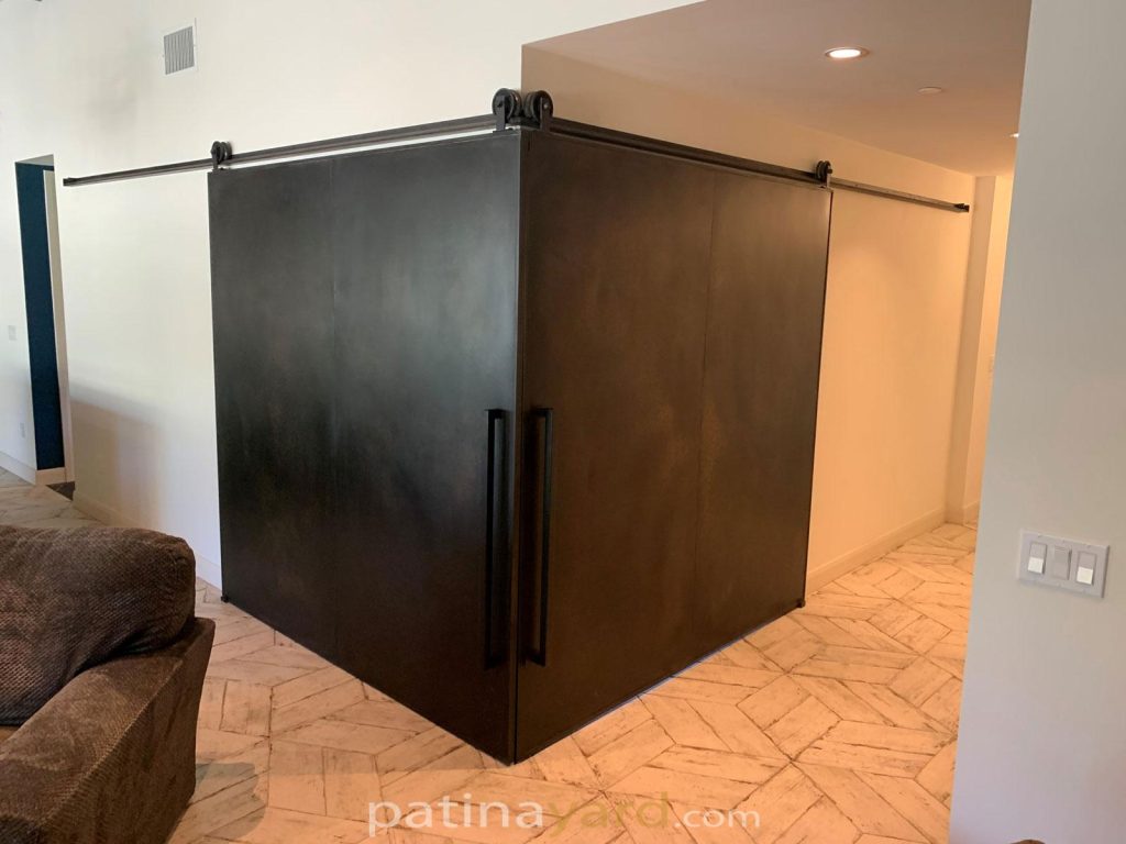 Patina steel doors in a corner