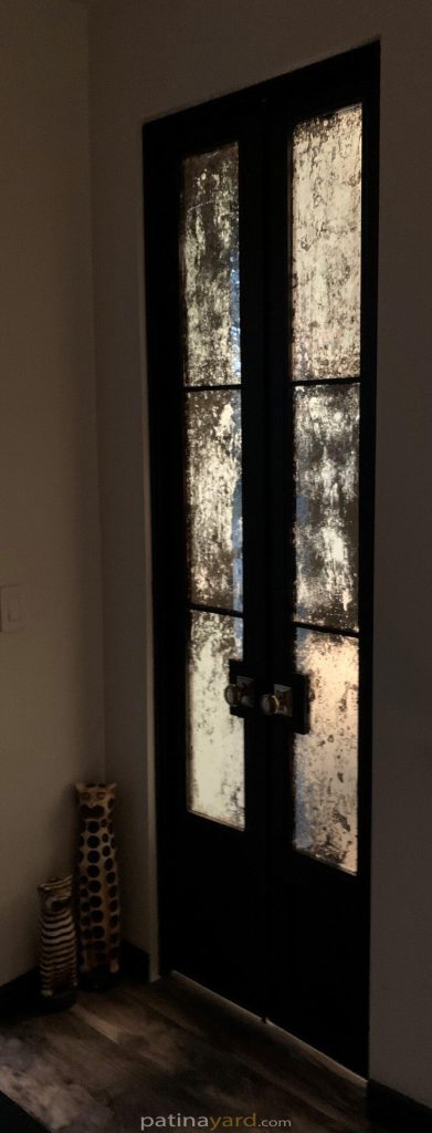 small double doors with antique mirrors