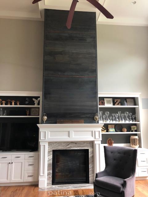 Steel wall facade above fireplace