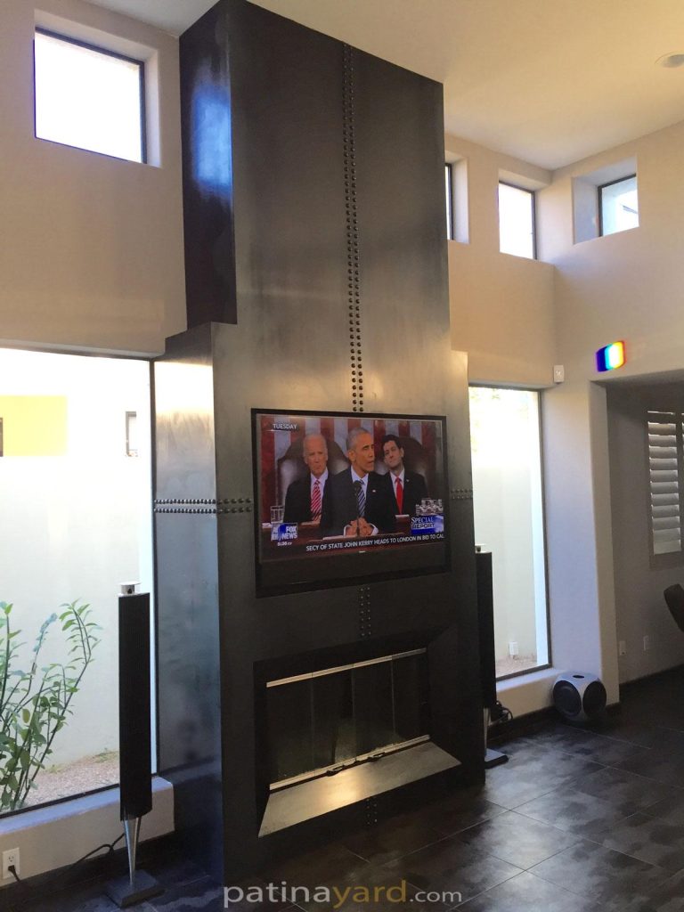 hot rolled steel fireplace with large rivets