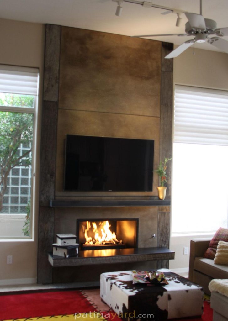 reclaimed wood and crete board fireplace with hot rolled mantle and hearth