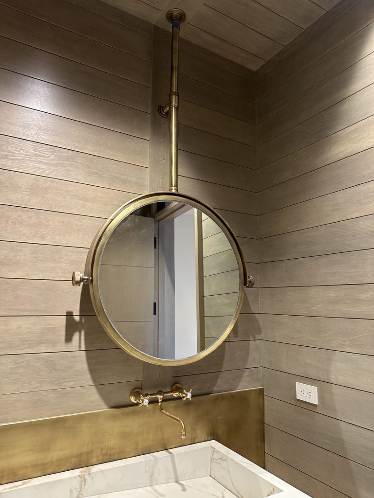 Bespoke Brass Pivoting and tilting ceiling mounted round mirror